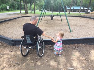 Father and Daughter at Inaccessible Swing Structure