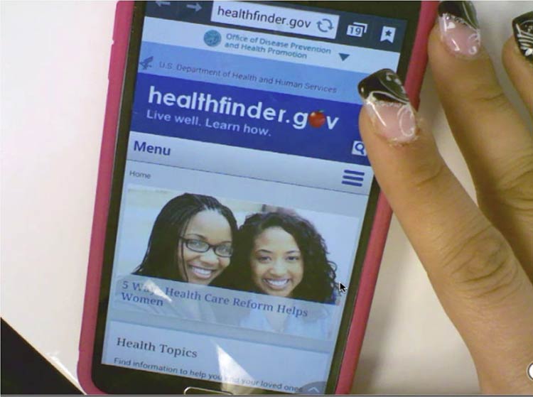 healthfinder.gov testing image of woman on her phone.