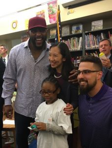 ; Dr. Leana Wen, Baltimore City Health Commissioner, is joined by current and former Baltimore Ravens players Crockett Gilmore and Ray Lewis to launch Vision for Baltimore, a program that will provide eye screenings and glasses for kindergarten through eighth grade students in Baltimore City schools.