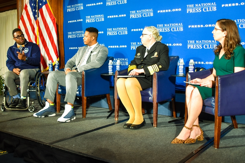 CNBC Correspondent Emily Wilkins interviewing a panel comprised of Admiral Rachel Levine, MD, Brandon Gassaway, and Dr. Feranmi Okanlami.  
