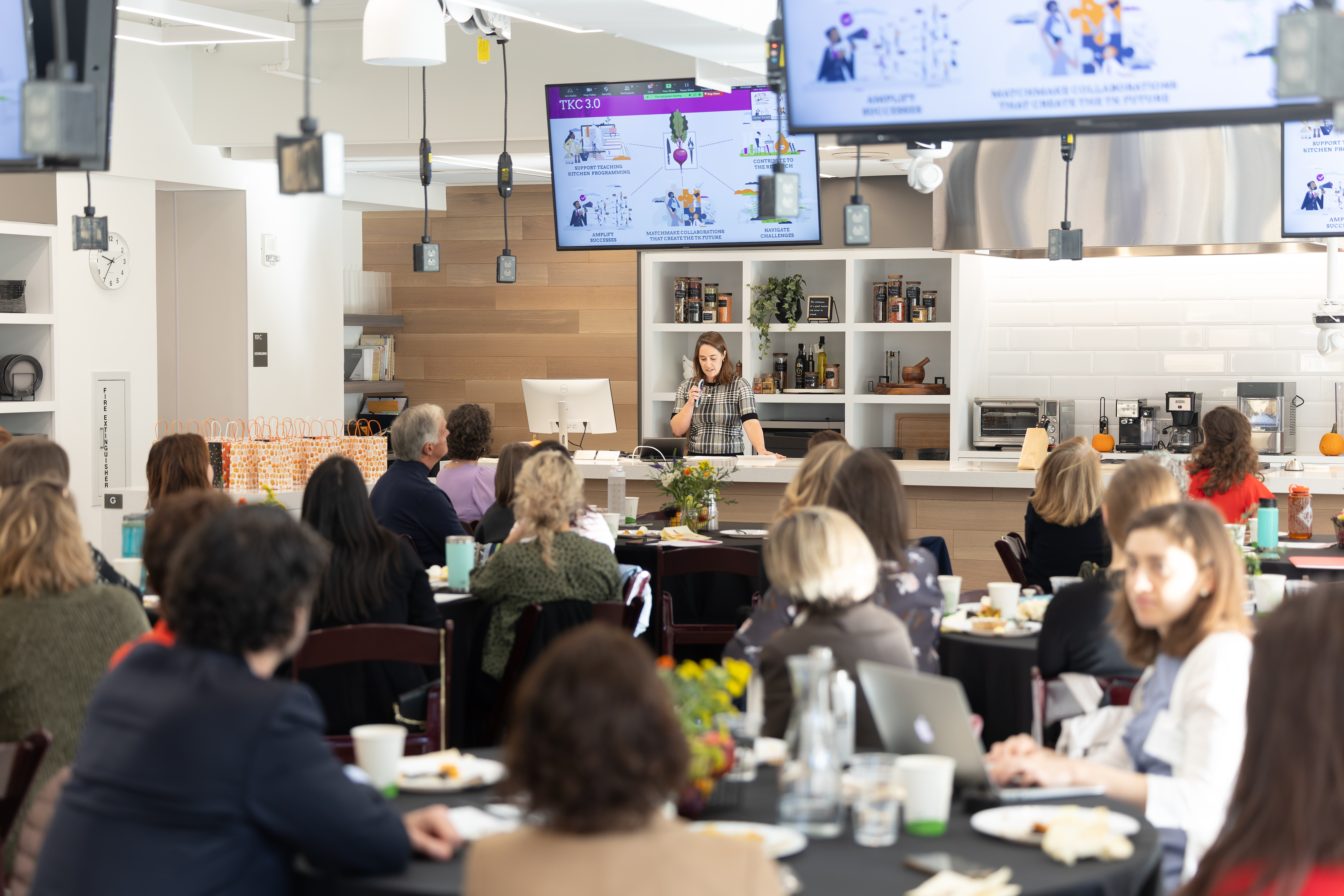 Image of people at a Teaching Kitchen Symposium.