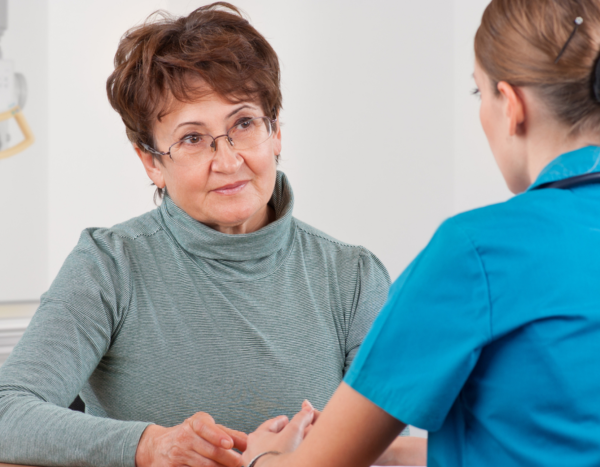 Woman talking with health care provider