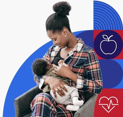 Una mujer de raza negra está amamantando a su bebé.