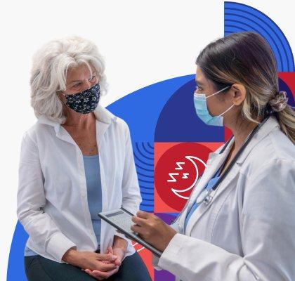 A doctor wearing a face mask takes notes while talking with a masked patient.