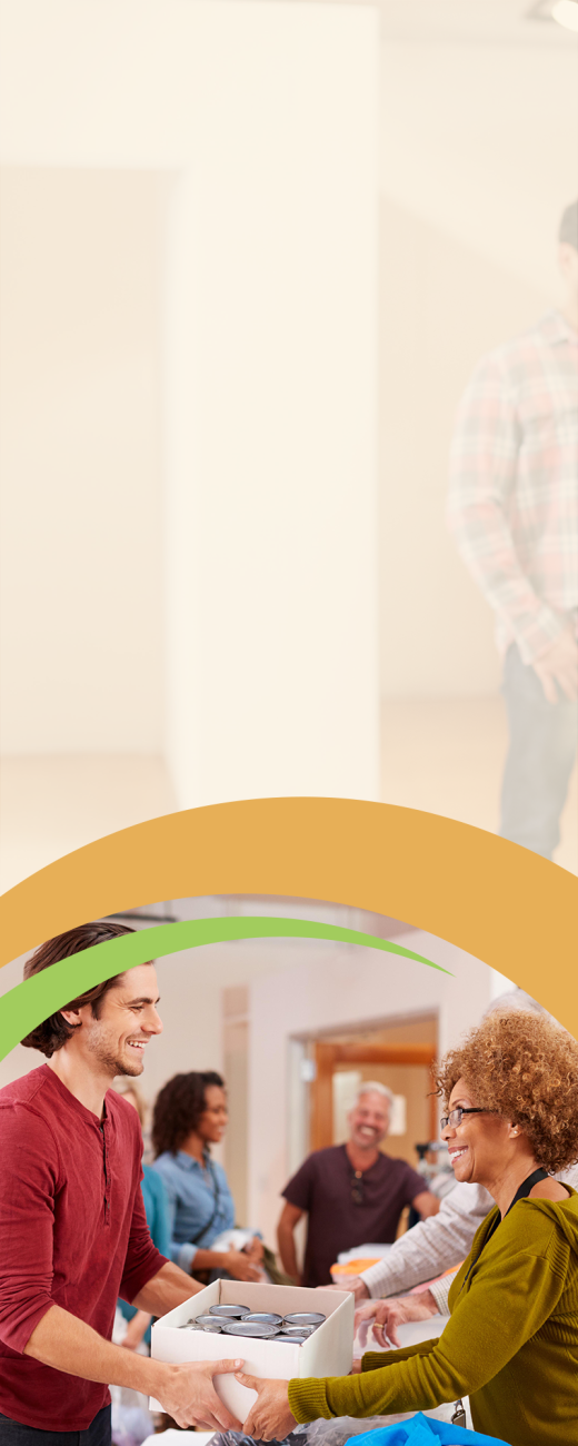 Woman handing brown box of food to man smiling 