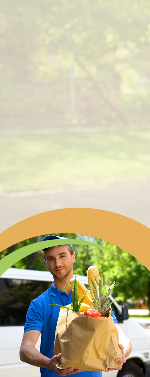 Man with blue shirt delivering a bag of groceries 