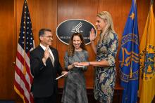 HHS Secretary Xavier Becerra (left) administers the oath of office to Elena Delle Donne (right) with PCSFN Acting Executive Director Rachel Fisher (center) looking on. 