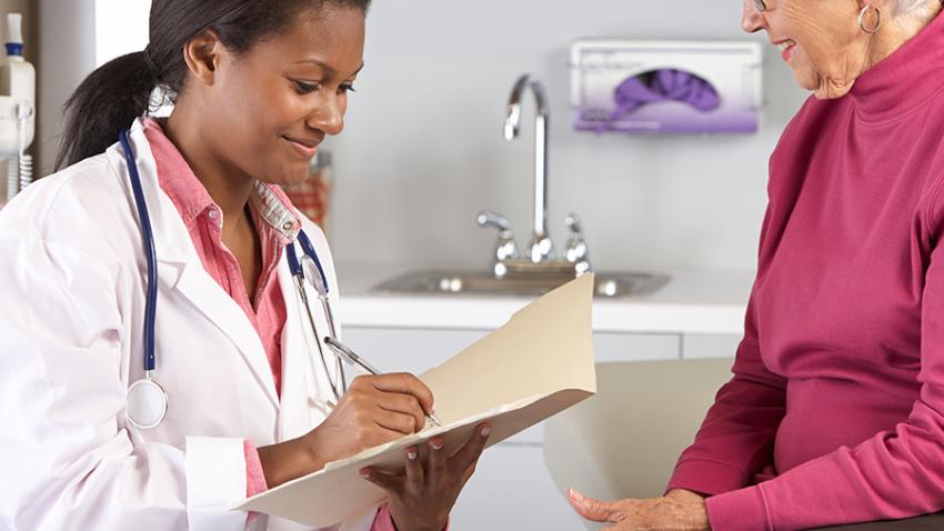 Health care provider talking with woman